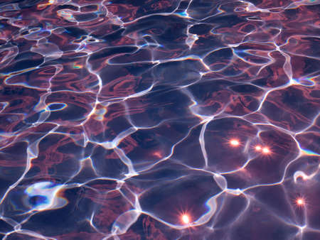 Abstract purple texture of swimming pool water with reflectionsの写真素材