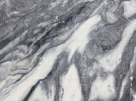 Black white marble texture in opencast mine. Mining cliff rough surface. Template to use as a backgroundの写真素材