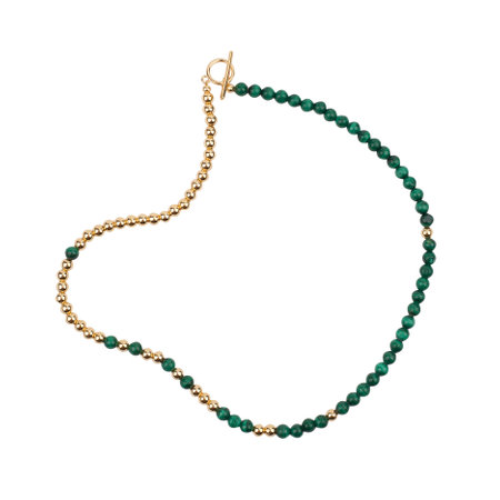 Golden necklace with green gemstones isolated on white background. close-up shotの写真素材
