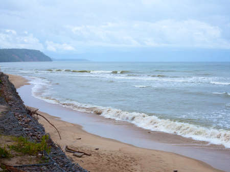 Cloudy sea view with stormy sea wavesの写真素材