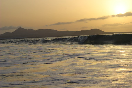 calm sunset at the beach with stonesの写真素材