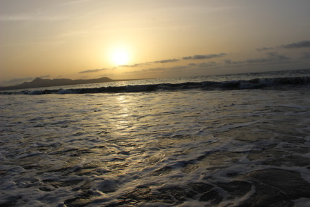 calm sunset at the beach with stonesの写真素材