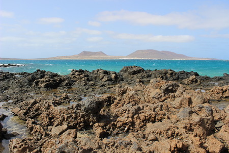 stony beach and the sea at lanzaroteの写真素材