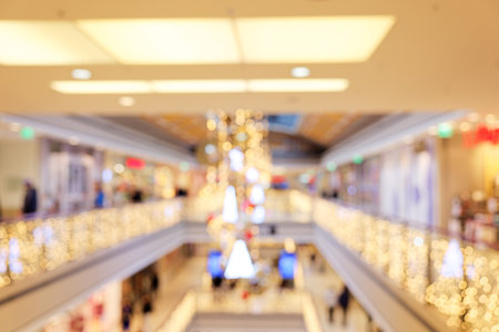 Christmas Shopping: Blurred Scene in Multi-Level Shopping Center with Christmas Lightingの写真素材