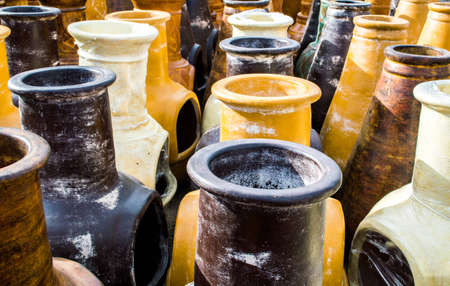 rows of colorful ceramic pottery freestanding fireplacesの写真素材