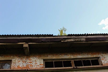 An old abandoned building of a warehouse for mineral fertilizers in June 2017, Arsenyevo, Russia.の写真素材