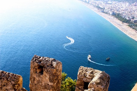 View of the city and Cleopatra Beach from the observation platform of Alanya Castle (Alanya, Turkey).の写真素材