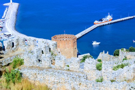 View of the Red Tower and harbor from the mountain (Alanya, Turkey).のeditorial素材