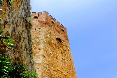 View of the Red Tower from the seafront (Alanya, Turkey).の写真素材