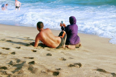 July, 2017 - A young Muslim married couple makes a selfie on Cleopatra Beach (Alanya, Turkey).のeditorial素材