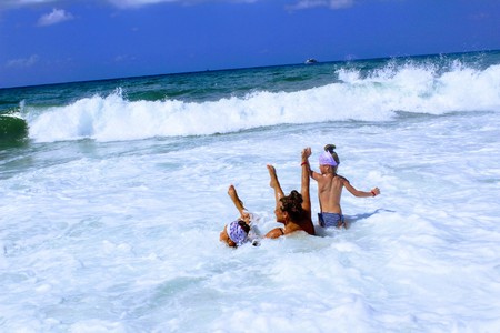 July, 2017 - A woman with two children bathing in the surf on the seashore at Cleopatra Beach (Alanya, Turkey).のeditorial素材