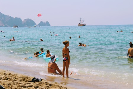 July, 2017 - Vacationers bathe in the sea and sunbathe in the sun on Cleopatra Beach (Alanya, Turkey).のeditorial素材