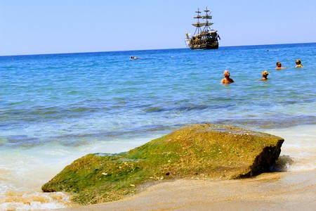 July, 2017 - Vacationers bathe in the sea and sunbathe in the sun on Cleopatra Beach (Alanya, Turkey).のeditorial素材