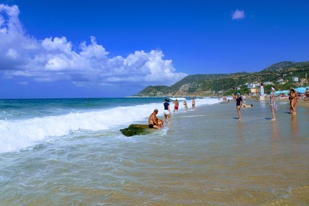 July, 2017 - Vacationers bathe in the sea and sunbathe in the sun on Cleopatra Beach (Alanya, Turkey).のeditorial素材