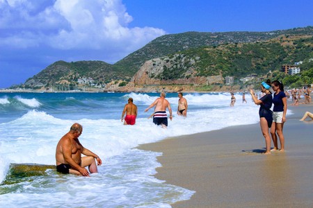 July, 2017 - Vacationers bathe in the sea and sunbathe in the sun on Cleopatra Beach (Alanya, Turkey).のeditorial素材