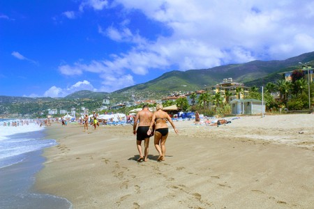 July, 2017 - Vacationers bathe in the sea and sunbathe in the sun on Cleopatra Beach (Alanya, Turkey).のeditorial素材