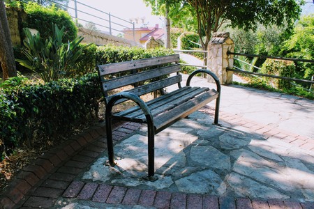 Alanya, Turkey, July 2017: a wooden bench in a small square.