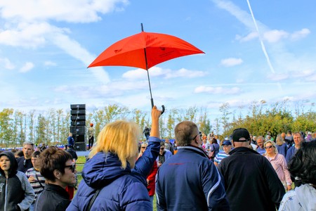 September, 16 2017, Tula, Russia - The International Military and Historical Festival "Kulikovo Field": a red umbrella in the woman's hand.のeditorial素材