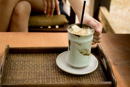 holding a cup of coffeeの写真素材