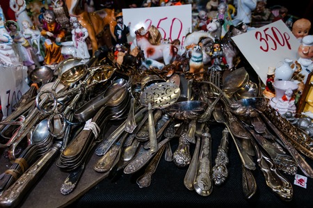 Moscow, Russia - March 19, 2017: Vintage patinated silver ware with elegant patterns on the table of an antique storeのeditorial素材