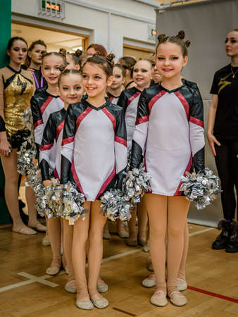 Moscow, Russia - December 22, 2019: Little girls sports team awaits start of performance at cheerleader competitionのeditorial素材
