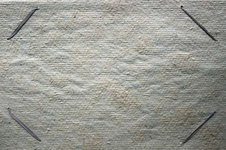 background of rough carboard with plant fibers and threads from plants as a photo frameの写真素材