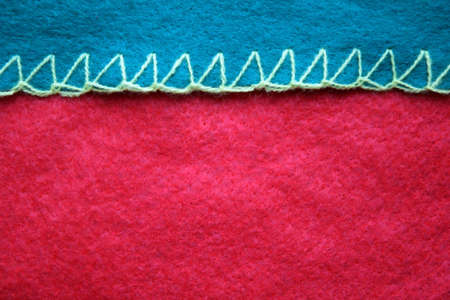 red background with green piping made of synthetic material sock for gifts for Christmas and New yearの写真素材