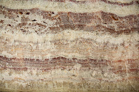 close-up onyx slab cut-off background with textural relief and wave patternの写真素材