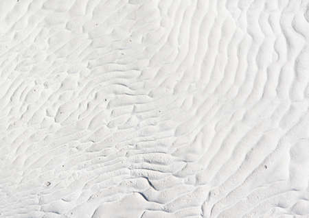 white background with curves and waves of water from the travertines of Pamukkale formed from calcium carbonateの写真素材