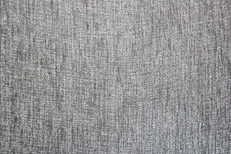 gray fabric background with texture of fibers and threadsの写真素材
