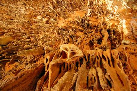 the ceiling of the cave with stalactites hanging down from the topの写真素材