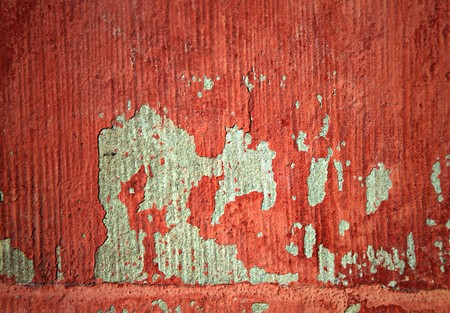 Grungy red wall background with lots of streaks の写真素材