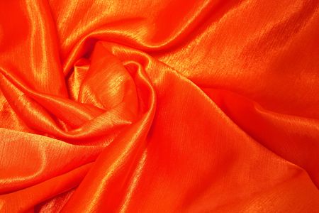 Orange-red satin fabric as backgroundの写真素材