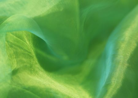 Close-up of a wonderfully shining organza background in greenの写真素材