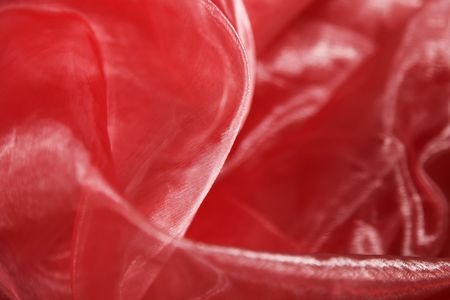 Close-up of a wonderfully shining organza background in redの写真素材