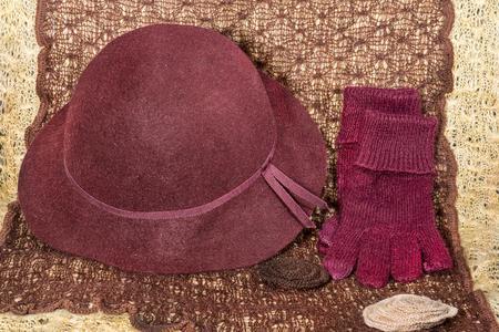 red gloves and hat on a large knitting yarnの写真素材