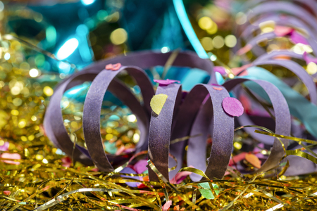 closeup of decorated carnival set and parties with serpentine and mask on confetti and party backgroundの写真素材