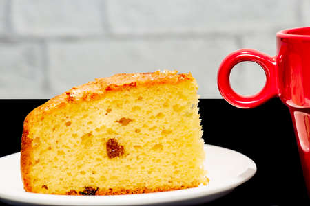 portion of homemade cake with cup of coffee on white backgroundの写真素材