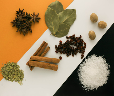 Aromatic spices on a striped yellow black background