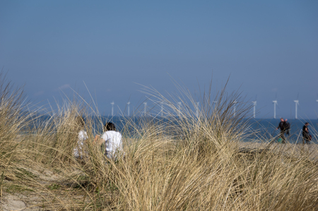 Sitting at the beach at Baltic Sea Copenhagenの写真素材