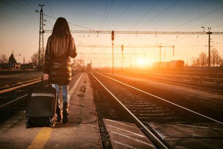Young traveler woman in railwayの写真素材