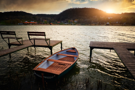 Boat on lake near pierの写真素材