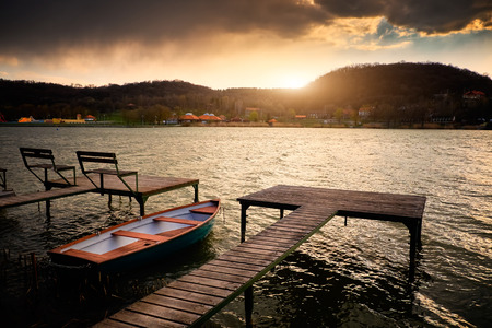 Boat on lake near pierの写真素材