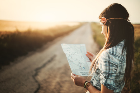 Traveler girl looking map