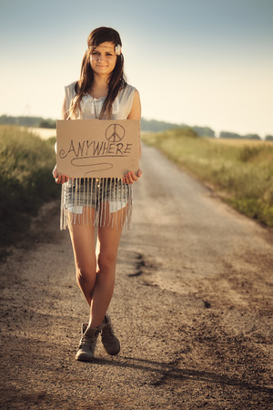 Hippie woman on the roadの写真素材