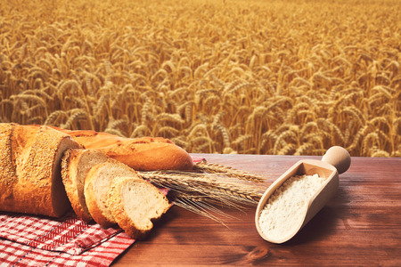 Bread wheat and flour on the table