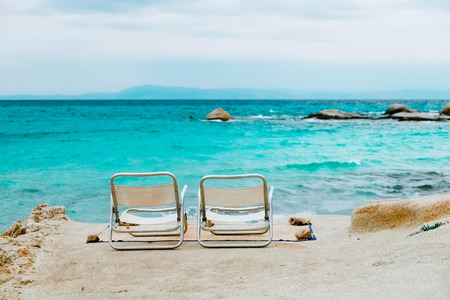 Two chairs on tropical beachの写真素材