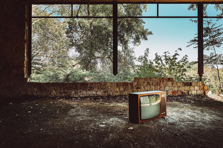 Old television in abandoned buildingの写真素材