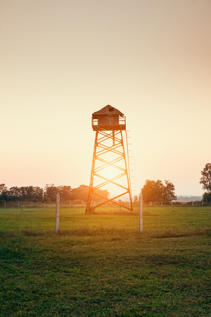 Old water tower on a fieldの写真素材