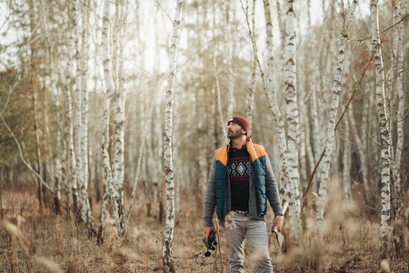 Man with binoculars in the forestの写真素材
